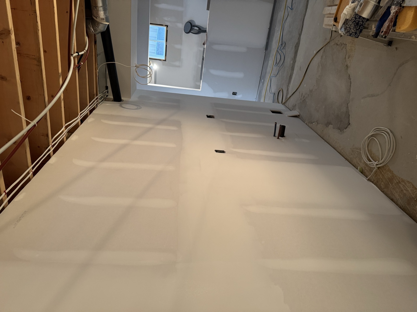 Smooth finished drywall wall sanded and ready for primer